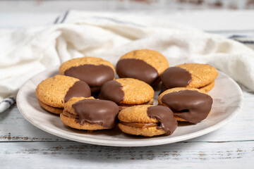 Chocolate cookie. Chocolate chip cookies baked with almond flour on a wooden background. patisserie products. Close up