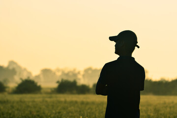 silhouette of a person in field