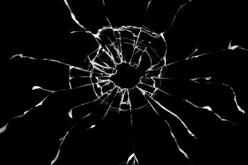 Broken glass from a bullet. Texture of broken glass.