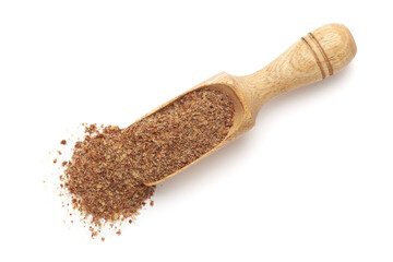 Organic Flaxseed Flour (Linum usitatissimum) in a wooden scoop, isolated on a white background. Top view.