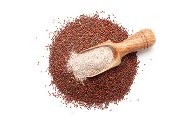 Top view of a wooden scoop filled with organic Ragi (Eleusine coracana) Flour. Isolated on a white...