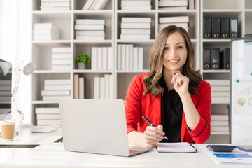 Businesswoman or accountant working with graph documents and charts to analyze market data, balance sheets, company accounts and net sales profits.