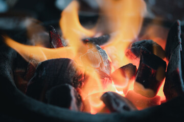 Burn charcoal in stove for cooking. Close up
