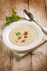 artichoke cream soup with sliced bread - 664868356
