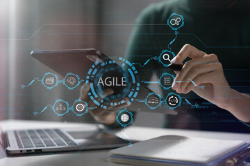 Agile development methodology concept. Business hand using laptop computer and tablet with virtual...