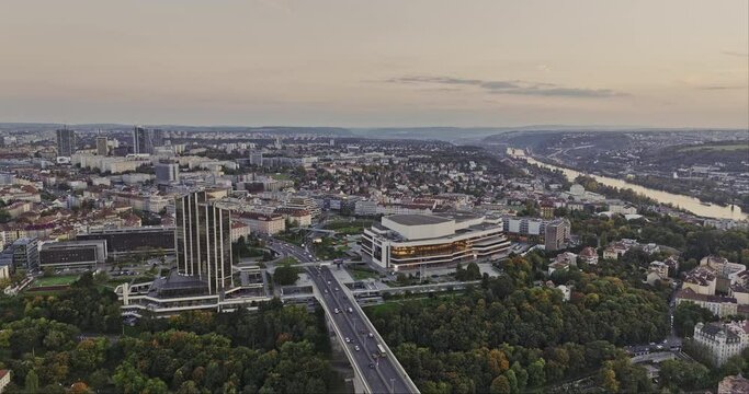 Prague Czechia Aerial v120 flyover Nuselsk&yacute; most bridge capturing congress center, busy street traffics on 5. května and cityscape of Pankr&aacute;c and Nusle at dusk - Shot with Mavic 3 Cine - November 2022