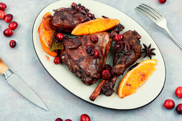 Roast chicken meat with orange and berries.