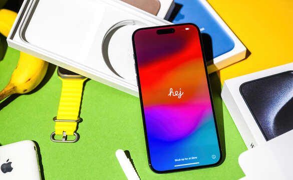 London, UK - Sep 28, 2023: Unboxing latest Apple iPhone 15 Pro Max with word Hej on display - Hej is the most common greeting in the Swedish language, and the equivalent of 'hi' in English