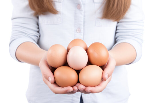 A woman's hands cradling fresh brown eggs, emphasizing their organic and healthy nature, a product of natural farming and a source of protein.