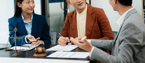 business people and lawyers discussing contract papers sitting at the table. Concepts of law,...