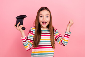 Photo of crazy young schoolkid girl spend summer holidays playstation gamer bluetooth controller winner isolated on pink color background