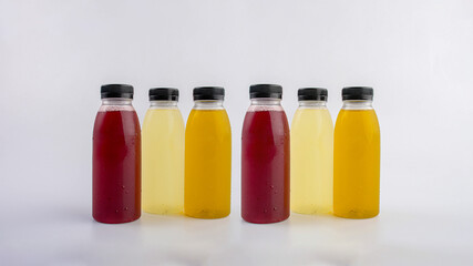 Fruit and vegetable juice bottles isolated on white background