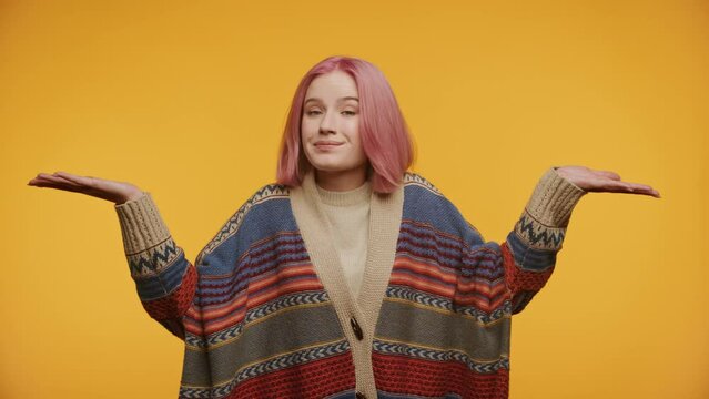 Woman Shoulder Shrug IDK Gesture on Yellow Background