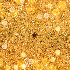 Golden Star on Abstract Glitter Background. Magic decoration. Christmas texture.