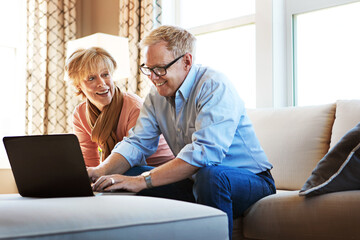 Laptop, mature or happy couple planning savings, property investment or online shopping together....