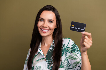 Photo of cheerful positive lady wear trendy clothes hold recommend use bank plastic card isolated on beige color background