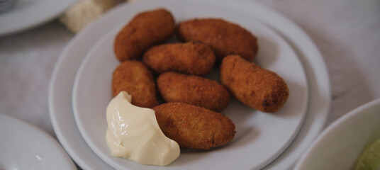 Traditional spanish croquettes with mayonnaise. Tapas food.
