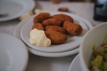 Traditional spanish croquettes with mayonnaise. Tapas food.