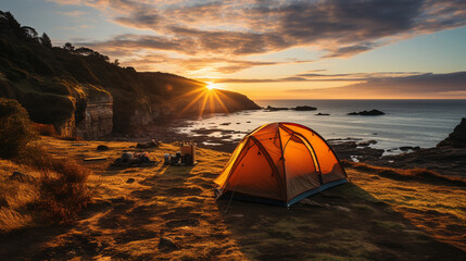 A coastal camping site with tents perched on the edge of a cliff, offering spectacular sunrise views over the sea
