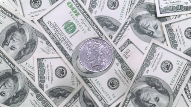 Five United States Dollars And Rotating One Hundred Dollar Bills.