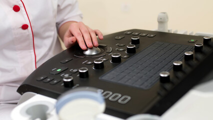 Close-up photo of an ultrasound scanner. Diagnostics. Sonography. Modern ultrasouClose-up photo of...