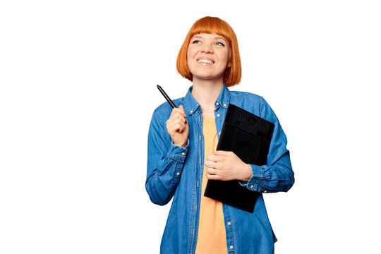 Smiling female designer holding a graphic tablet.