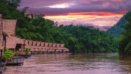 Tropical beach houses on the River Kwai in Thailand.Wooden floating raft house in river Kwai...