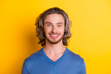 Photo of cheerful positive man wear blue sweater smiling showing white teeth isolated yellow color background