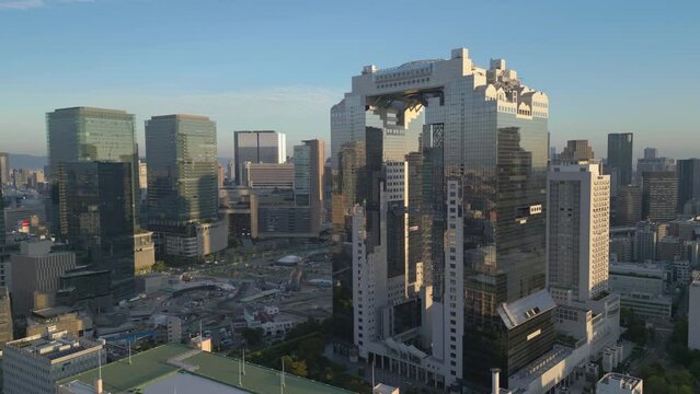 wide flying left view of Umeda Sky Building in Osaka Japan