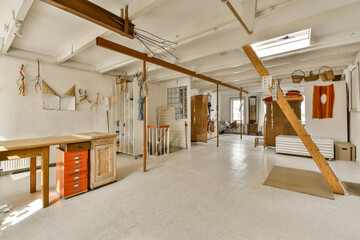 the inside of a room that is being used as an art studio for painting and other things to be displayed