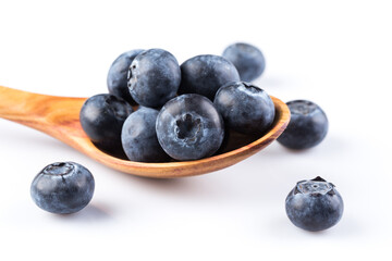 Fresh blueberries in wooden spoon