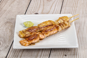 Grilled salmon skewer with sauce