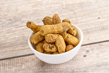 Raw ripe unpeeled peanut heap