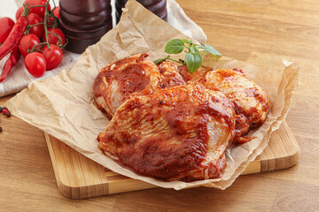 Marinated chicken leg in tomato sauce