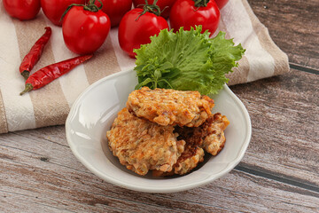 Fried salmonn cutlet in the bowl
