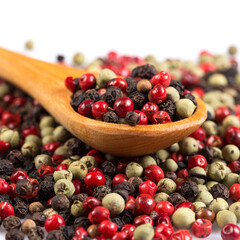Pepper seasoning mix in wooden spoon
