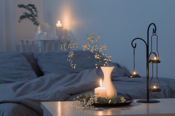 antique candlestick with burning candles in bedroom