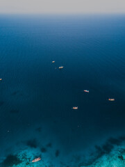 View of the sea with little boats from a drone