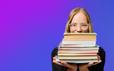 Caucasian female student in glasses holds a lot of books in her hands on a purple background. Book Lovers Day.