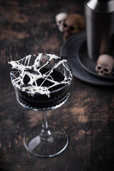 Halloween cocktail with spider cobweb