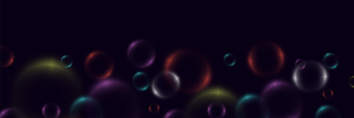 Abstract background with neon bubbles, iridescent colorful glass balls or spheres on a black background.