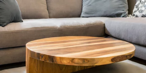 Fotobehang live edge wooden accent coffee table near sofa close up interior design of modern living roo © Enzo