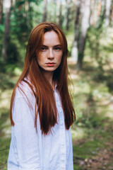 Beautiful woman natural face freckles casual female portrait lifestyle beauty girl. Outdoor girl portrait in green summer forest