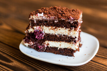 Sugar dessert, cake with cream and chocolate. Holiday baking. Homemade pastry
