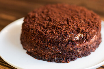 Sugar dessert, cake with cream and chocolate. Holiday baking. Homemade pastry