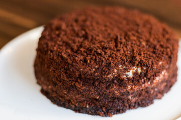 Sugar dessert, cake with cream and chocolate. Holiday baking. Homemade pastry