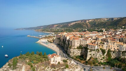 Fototapeta premium Tropea - Italy - Aerial view of the coast of Tropea in the summer season to the beach between the old town and the castle, Calabria