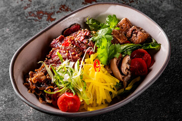 Donburi bowl with beef meat and vegetables on table