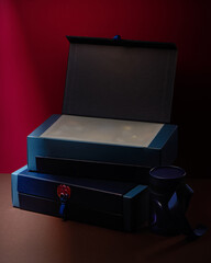 Blue gift boxes of fantasy chocolate with ribbons and dragon