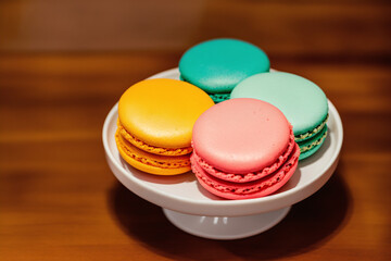 Colorful macaroons on a plate. Sweet cookies. Generative AI